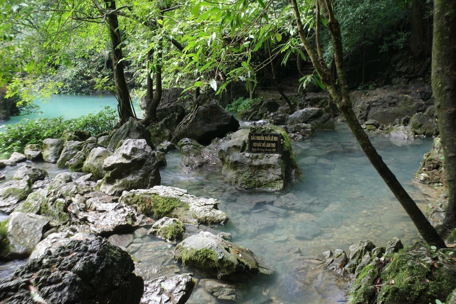Headwaters of Lenin Stream in Pac Bo on the Cao Bang Loop with crystal clear turquoise water